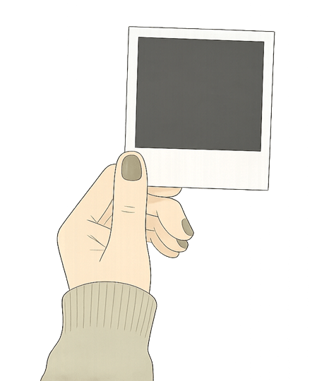 Eine Hand hält ein leeres Polaroid Foto. Das Bild symbolisiert Trauer, Verlust und die Erinnerungen an einen geliebten Menschen.